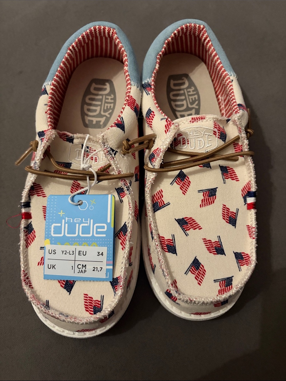 Hey Dude Kids Cream Canvas Moccasins with Red and Blue Flag Print